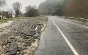 Flood damage evident on State Highway 6 after severe flooding.