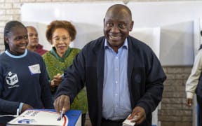 South African President Cyril Ramaphosa casts his ballot Wednesday May 29, 2024 for the general elections in Soweto, South Africa. South Africans are voting in an election seen as their country's most important in 30 years, and one that could put them in unknown territory in the short history of their democracy, the three-decade dominance of the African National Congress party being the target of a new generation of discontent in a country of 62 million people — half of whom are estimated to be living in poverty. (AP Photo/Jerome Delay)