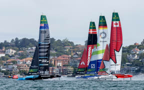 New Zealand SailGP Team helmed by Peter Burling, ROCKWOOL Denmark SailGP Team helmed by Nicolai Sehested, Germany SailGP Team presented by Deutsche Bank helmed by Erik Heil and Canada NorthStar SailGP Team helmed by Giles Scott on Race Day 2 of the KPMG Australia Sail Grand Prix in Sydney, Australia. Sunday 9 February 2025. Rolex SailGP Championship Event 3 Season 2025. Photo: Felix Diemer for SailGP. Handout image supplied by SailGP