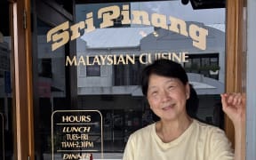 Sri Pinang owner Ange Siew in from of her iconic K-road restaurant