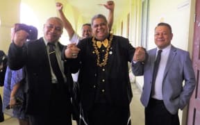 Laauli (middle) celebrates his not guilty verdict