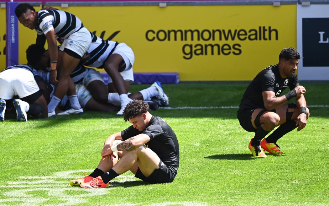 Che Clark and Dylan Collier show their disappointment after Fiji won in extra time at the 2022 Commonwealth Games.