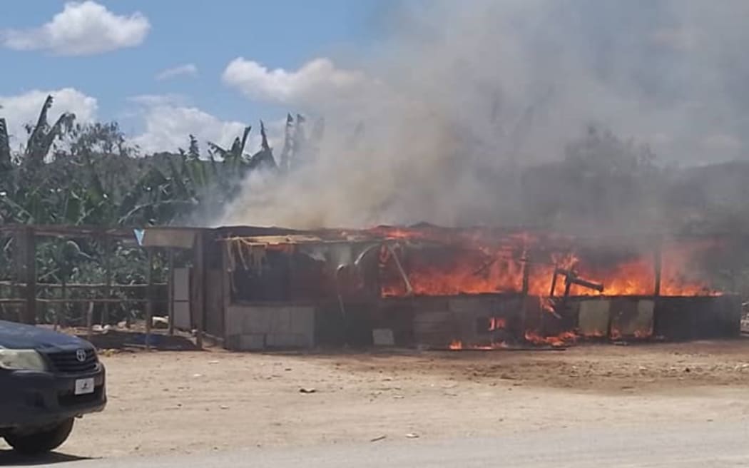 Burning stalls at the Kennedy Estate, Port Moresby