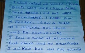 A handwritten note from a Somalian refugee in Nauru, who has become pregnant after being allegedly raped, and is seeking a termination in Australia.