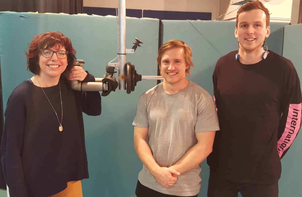 Melanie Bussey, Jayden Pinfold and Lorenz Kissling next to the machine they use to deliver a precise impact to a volunteer's chest.