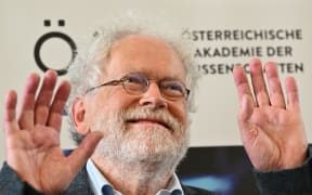 Austrian physicist Anton Zeilinger smiles during a press conference on October 4, 2022 at the University of Vienna, after he was awarded with the 2022 Nobel Prize in Physics. - The Royal Swedish Academy of Sciences has decided on October 4, 2022 to award the 2022 Nobel Prize in Physics to Anton Zeilinger, among two other quantum mechanics physicians. (Photo by JOE KLAMAR / AFP)