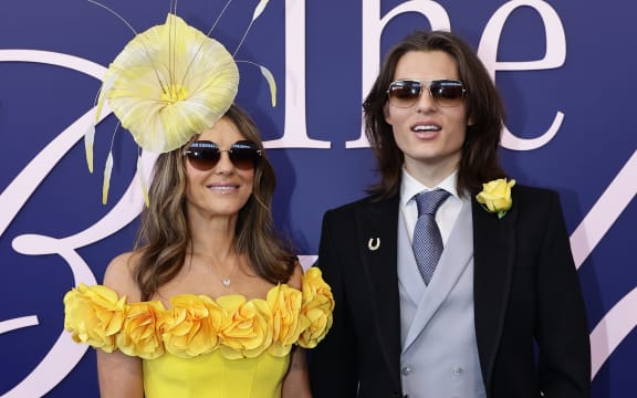 Elizabeth Hurley and Damian Hurley pose for a photo during 2024 Melbourne Cup Day at Flemington Racecourse on November 05, 2024 in Melbourne, Australia.