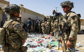 U.S soldiers from the XVIII Airborne Corps in  position guarding the at Hamid Karzai International Airport in Kabul, Afghanistan, on Aug 27, 2021.
