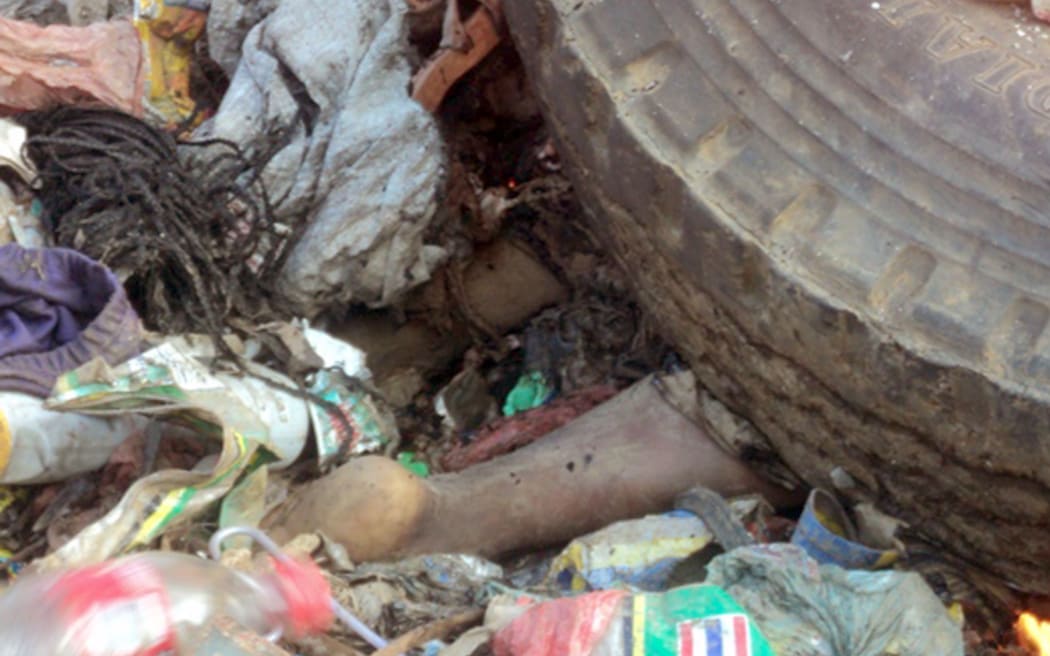 Remains of a young mother killed after being accused of sorcery in Mount Hagen city in the Western Highlands of Papua New Guinea.