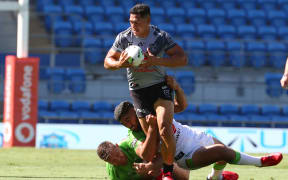 Roger Tuivasa-Sheck of the NZ Vodafone Warriors attacks during their match against the Canberra Raiders in the NRL.