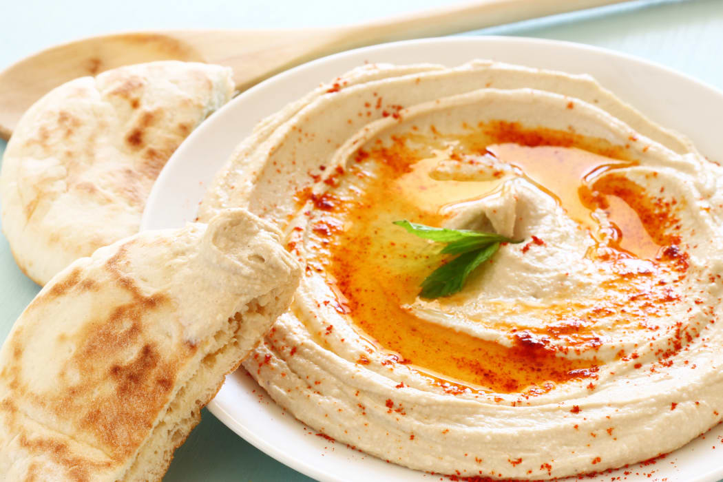 hummus dip plate on wooden table
