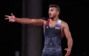 (FILES) Egypt's Mohamed Ibrahim Elsayed reacts after being defeated by Ukraine's Parviz Nasibov in their men's greco-roman 67kg wrestling semi-final match during the Tokyo 2020 Olympic Games at the Makuhari Messe in Tokyo on August 3, 2021. French police early August 8, 2024, arrested an Egyptian wrestler taking part in the Olympics over allegedly groping a woman in a bar, prosecutors said. Authorities detained Mohamed Elsayed, 26, in front of a cafe in the French capital's 13th district at around 5 am after he was accused of "placing a hand on the buttocks of a woman patron", the Paris prosecutor's office said. (Photo by Jack GUEZ / AFP)