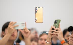 The Apple iPhone Air is displayed during Apple's "Awe-Dropping" event at the Steve Jobs Theater on the Apple Park campus in Cupertino, California, on September 9, 2025. (Photo by Nic Coury / AFP)