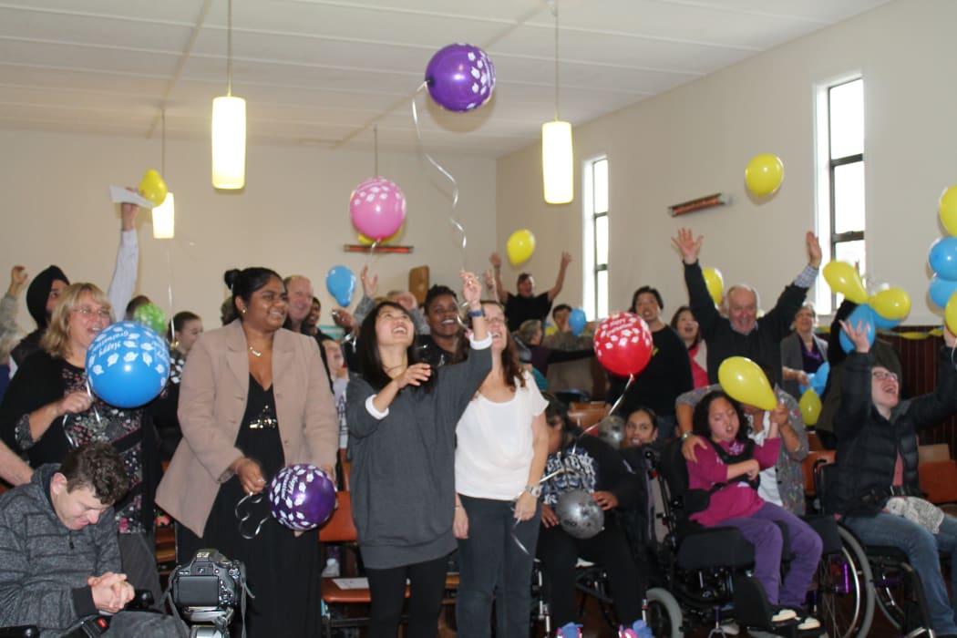A photo of families and carers celebrating at the STARS Graduation Ceremony.