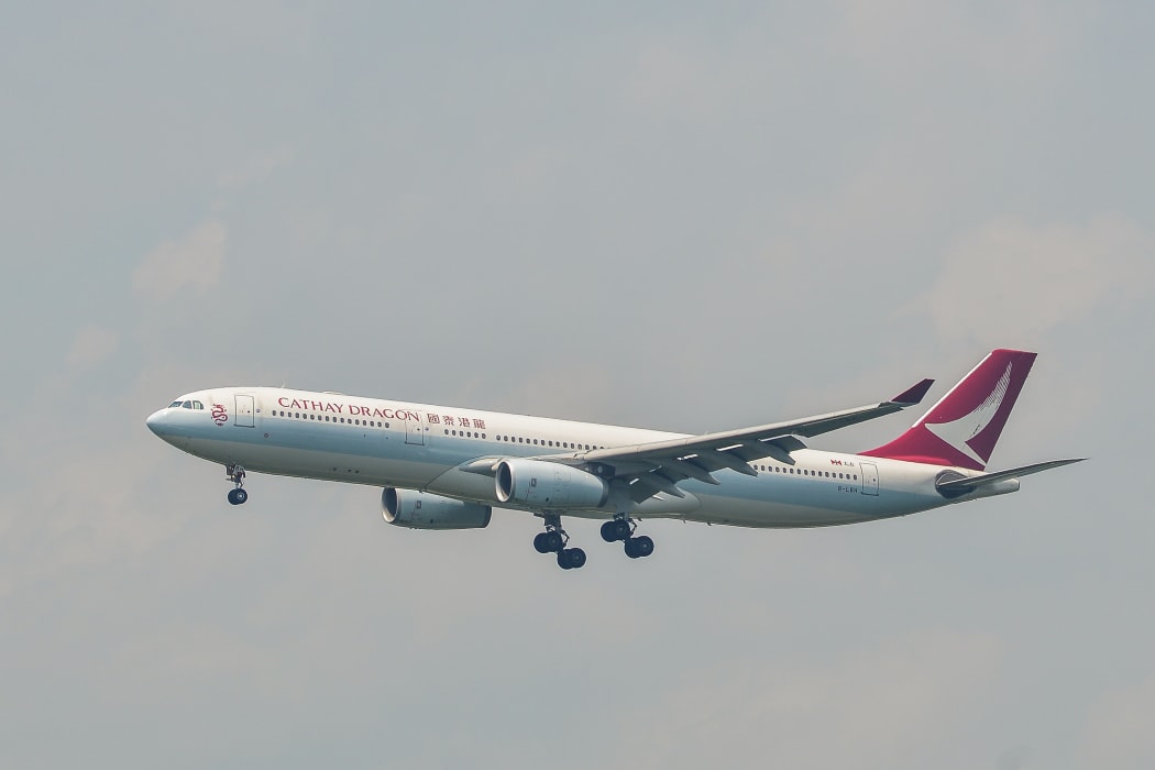 An Airbus A330-300 airplane of Cathay Dragon landing.
