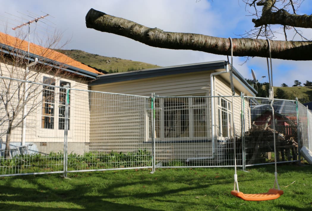 The family are living in a sleepout at the back of the property and are preparing a case against the EQC.