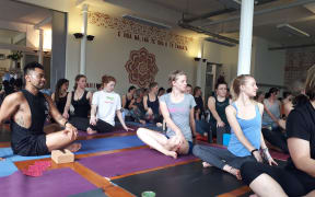 Instructor Jase Te Patu and his yoga class