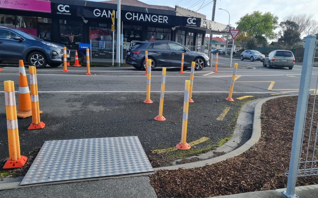 A forest of reflective poles now greets motorists approaching the intersection