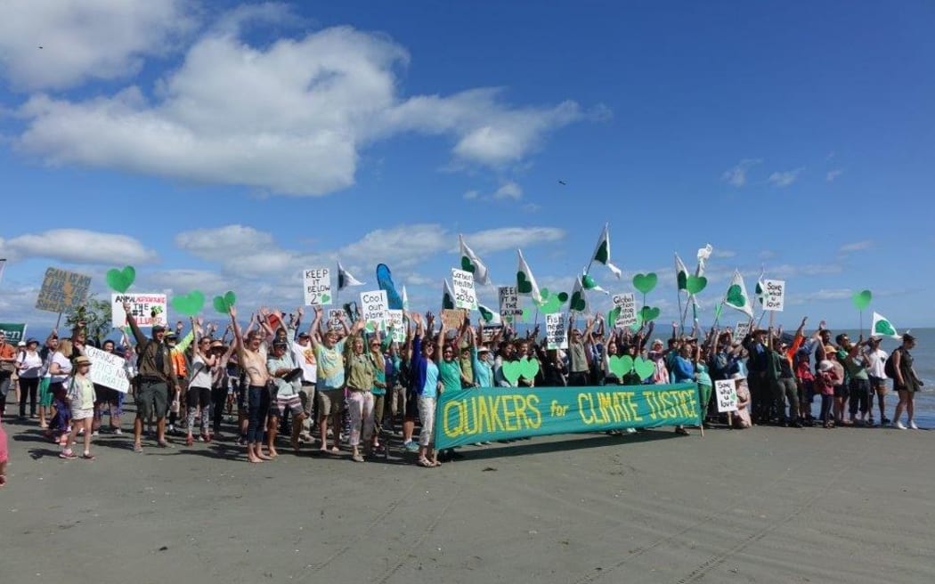 Several hundred climate change protest marchers gathered on Tahunanui Beach this morning, before walking into Nelson City to protest against climate change.