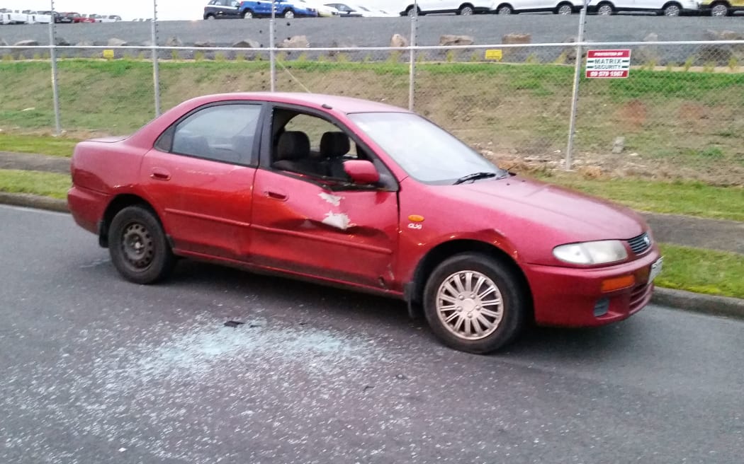 Damage to a car parked across the street from factory, 20m away from the gas tank.