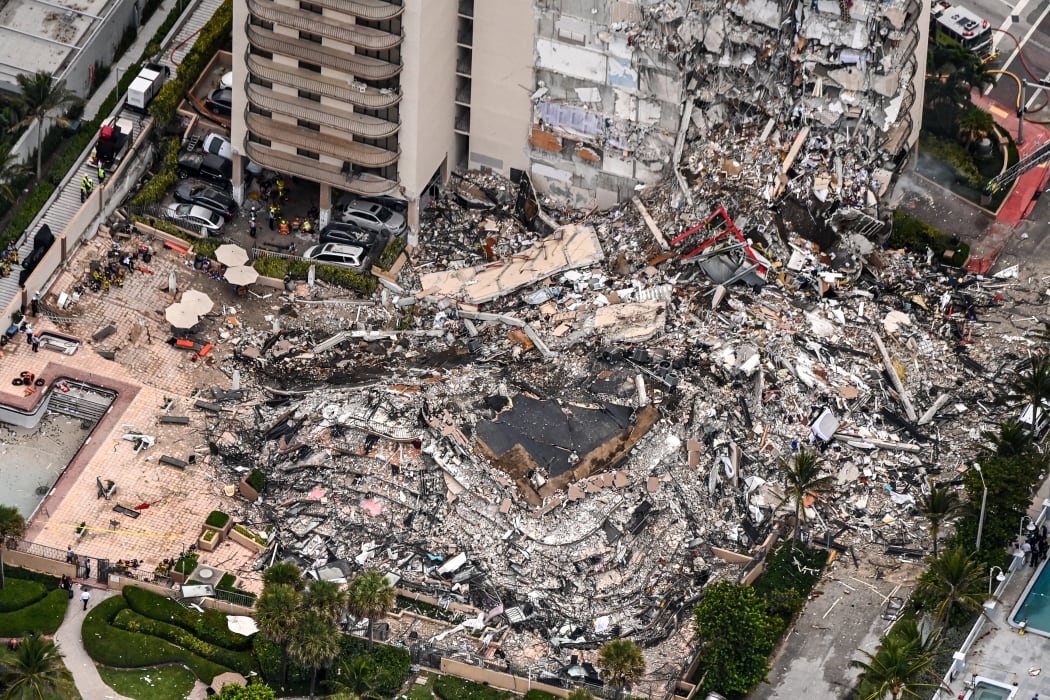 This aerial view, shows search and rescue personnel working on site after the partial collapse of the Champlain Towers South in Surfside, north of Miami Beach