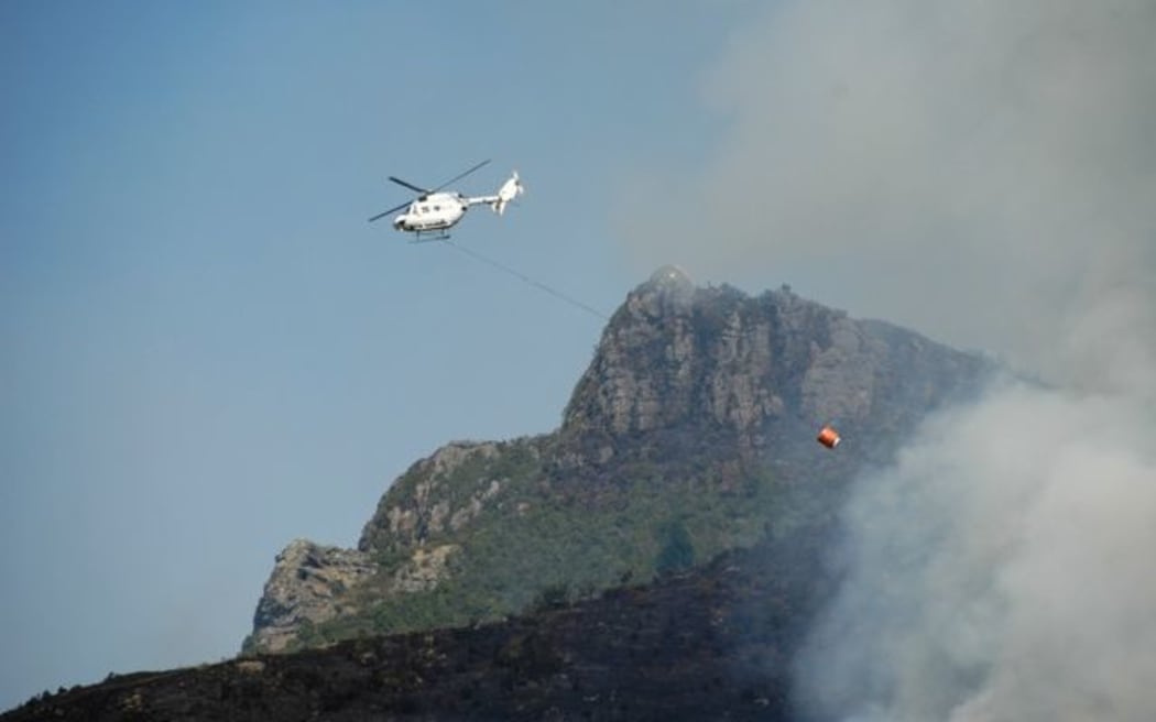 A helicopter takes part in fire-fighting efforts.