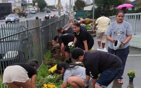 Rotumans plant flowers at the Masjid E Umar mosque in Auckland.