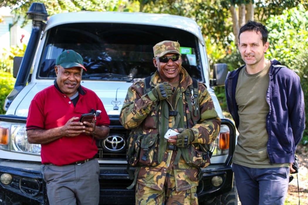Johnny Blades with PNG earthquake response official, Matthew Waram and PNG Defence Force soldier Kavin Haihe