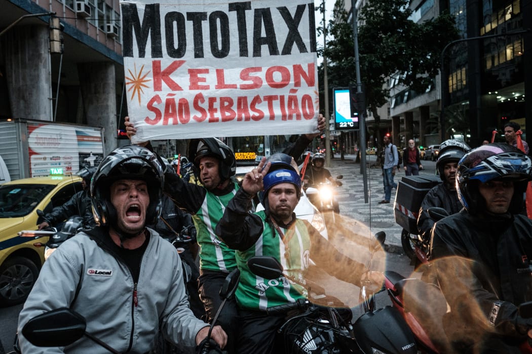 Motorbike taxi drivers protest during a nationwide strike called by unions opposing austerity reforms in Rio de Janeiro, Brazil, on April 28, 2017.