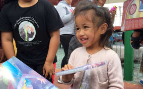 Waitangirua community Christmas Party. Locals received a free sausage sizzle, some received food hampers and christmas gifts were handed out to the children.