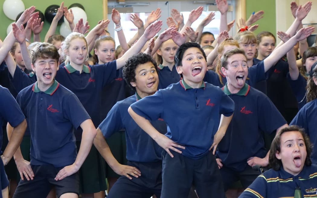 Pupils at Dunedin's Tahuna Intermediate do a haka for the All Blacks.