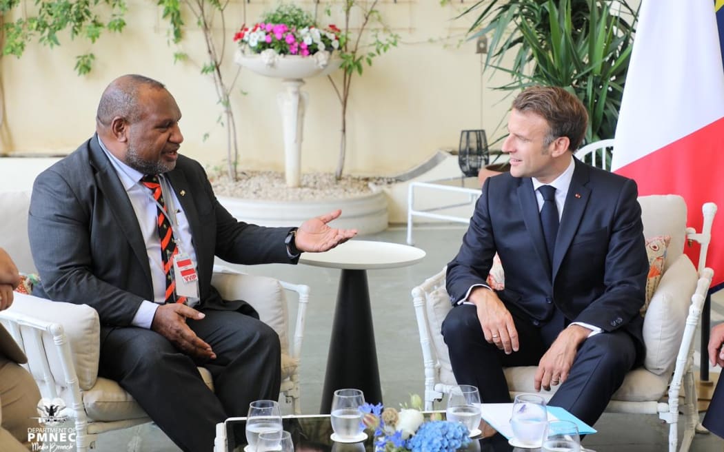 PNG Prime Minister James Marape, left, and French President Emmanuel Macron.