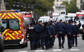 Police and military personnel block the bridge near Paris Police headquarters after four officers were killed in a knife attack on October 3, 2019 in Paris, France.