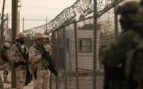 Members of the Mexican Army secure an area outside the prison of Ciudad Juarez number 3 after an attack in Ciudad Juarez, Chihuahua.