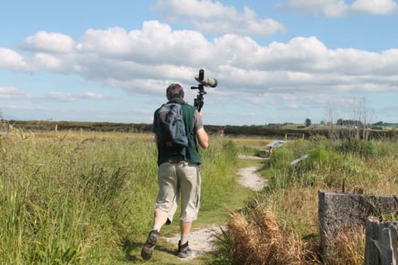 Keith Woodley off to the hide on the Miranda foreshore
