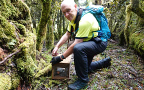 Ian Rasmussen checks a trap in the Ruahine Range.