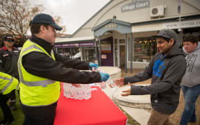 Red Cross volunteers handing out water in Havelock North. 20 August 2016.
