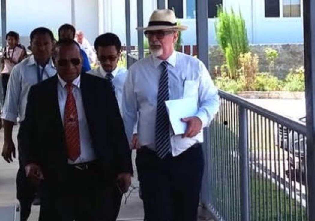 Greg Sheppard (centre) working as a lawyer in Port Moresby, representing PNG opposition leader Belden Namah