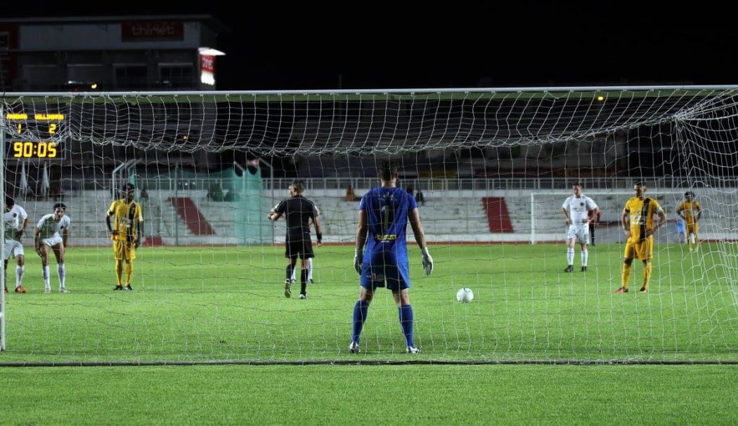 Magenta's Nicolas Marin stares down Scott Basalaj from the spot as he prepares to score the equaliser.