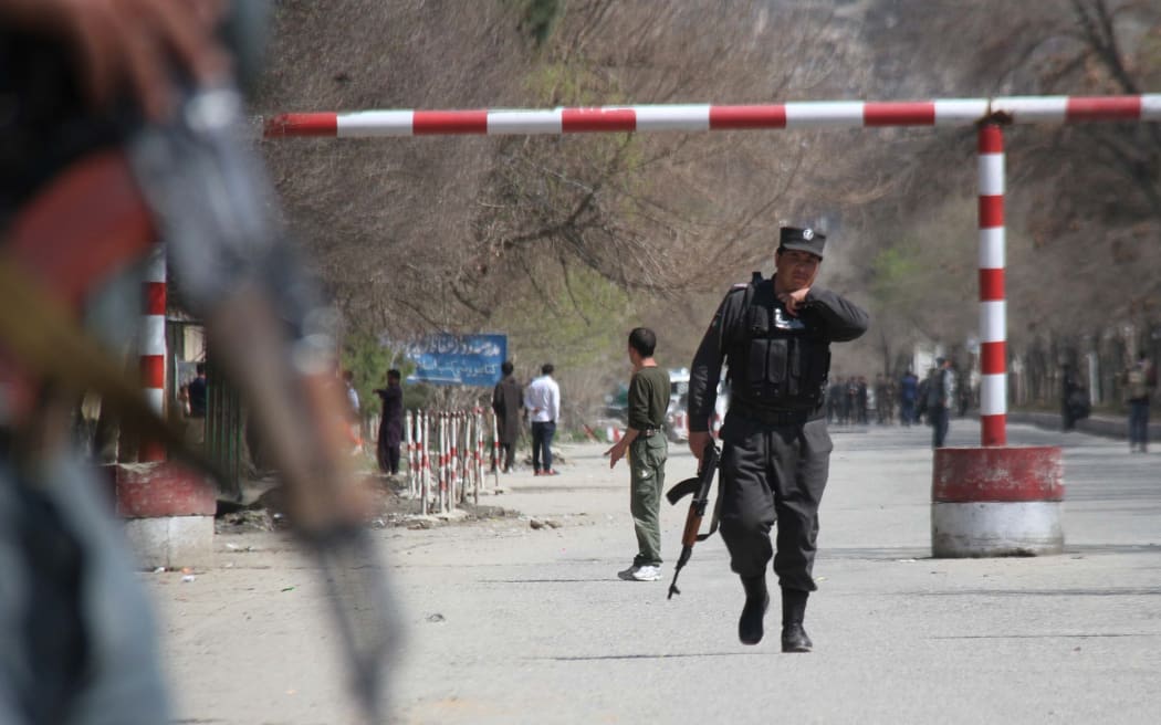 KABUL, AFGHANISTAN - MARCH 21: Afghan security officials inspect the suicide attack site in Kabul, Afghanistan on March 21, 2018. A suicide attack outside a mosque in Kabul has killed at least 26 people and wounded 18, officials and local media reported. Haroon Sabawoon / Anadolu Agency
