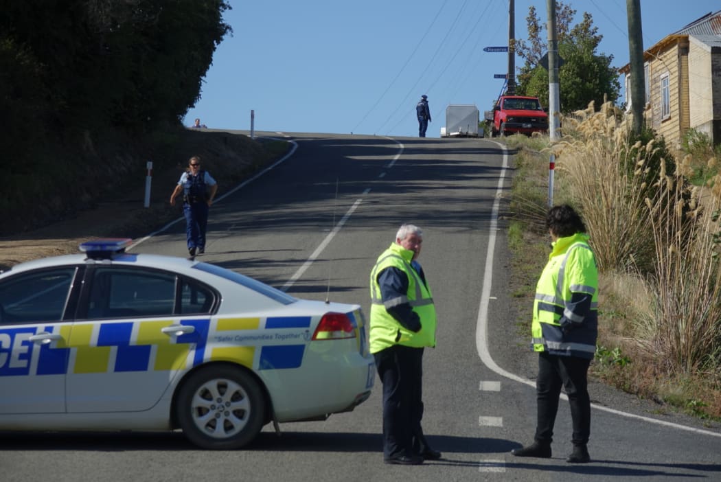 A section of Coast Road is closed after a woman was found dead inside a property.