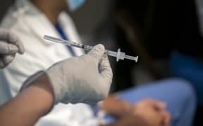 A syringe filled with Covid-19 vaccine ready to be administered. This week Mass General Hospital in the US administered the first of its Covid-19 vaccinations to employees.