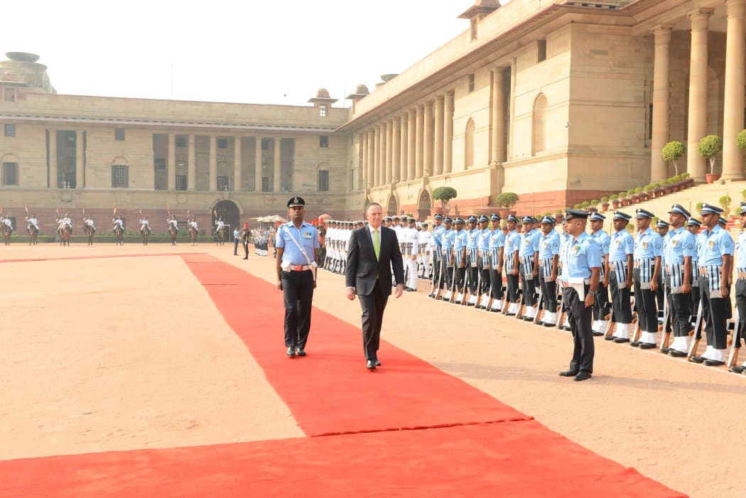 Prime Minister John Key inspects troops at the Indian Presidential Residence in New Delhi on 26 October 2016.