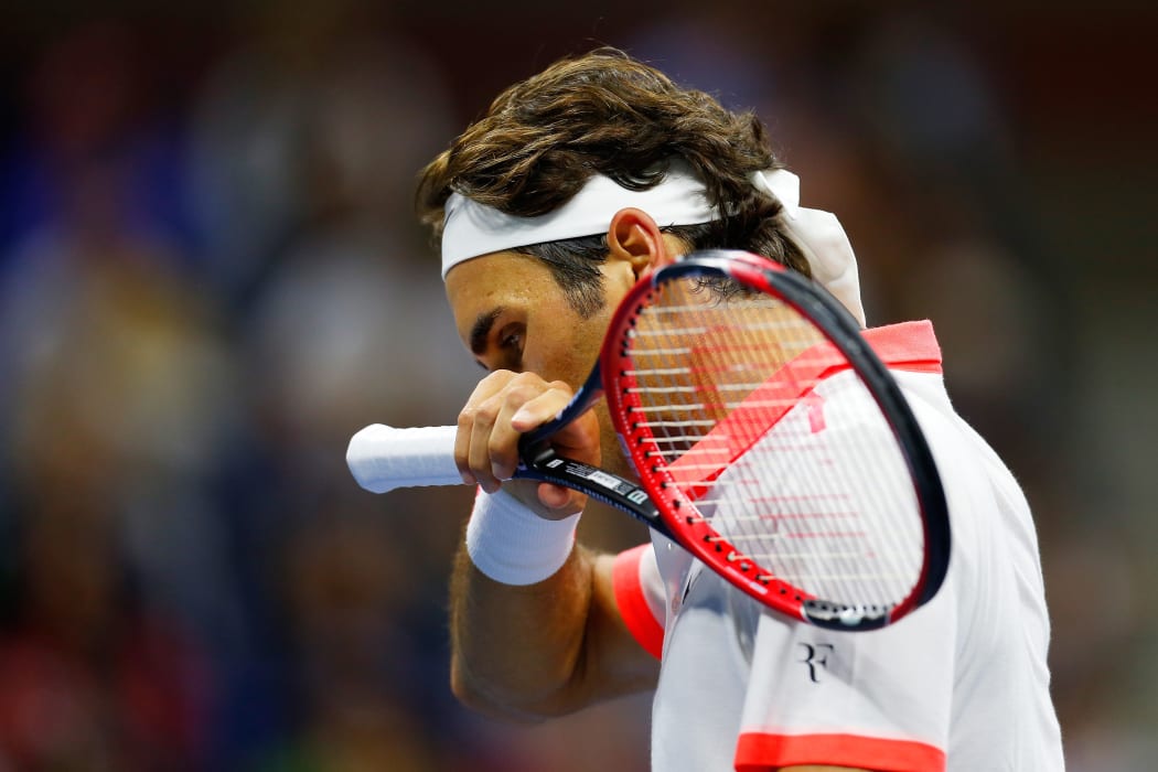 Roger Federer of Switzerland reacts against Novak Djokovic of Serbia during their final at the 2015 US Open at the USTA Billie Jean King National Tennis Center on September 13, 2015 Mike Stobe/Getty Images for the USTA/AFP
