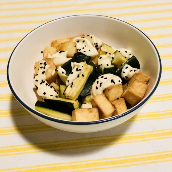 A vegetarian variation on a Hawaiian poke bowl, containing rice, tofu, courgette, parsnip, and wasabi mayo.