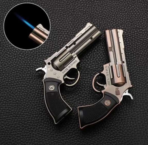Police confirmed that it was an 'imitation firearm' but denied that it was a lighter.