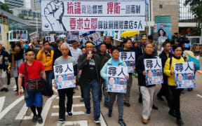 Crowds gather calling for free speech in response to the disappearance of five booksellers from Hong Kong.