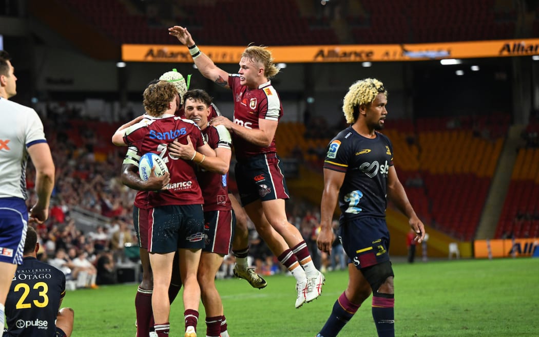 Suliasi Vunivalu celebrates scoring a try with team mates during the Super Rugby Pacific Round 9 match between the Queensland Reds and the Highlanders at Suncorp Stadium in Brisbane.