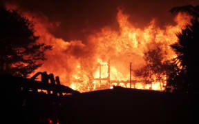 The New Plymouth house at the centre of a nearly 12-hour standoff with police earlier this month has gone up in flames.