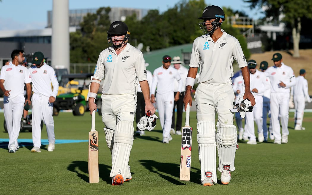 Century makers Jeet Raval and Tom Latham.